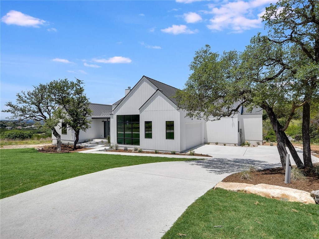 Home exterior with black metal roof