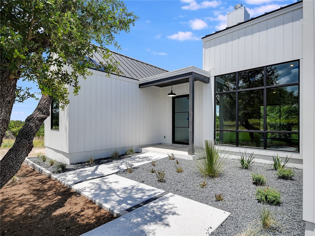 Home exterior with black metal roof