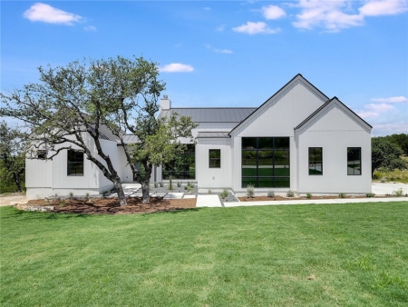 Home exterior with black metal roof