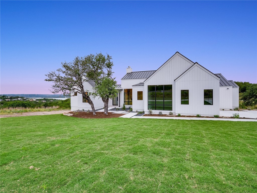 Home exterior with black metal roof