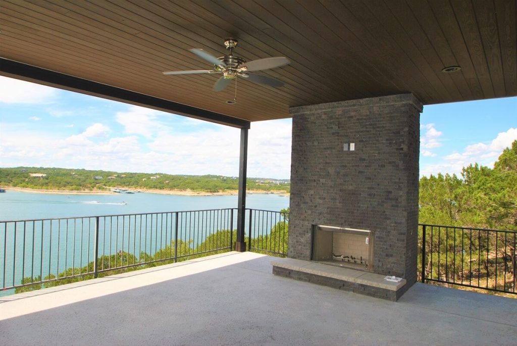 covered patio with outdoor fireplace